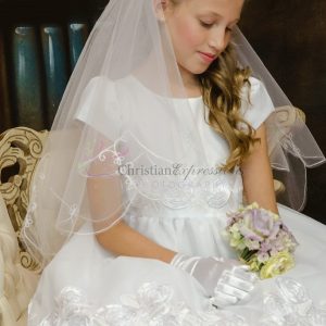 first communion dress with large rosettes