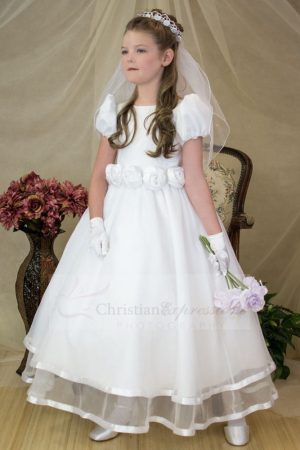 Puf sleeves and bateau neckline highlight satin bodice